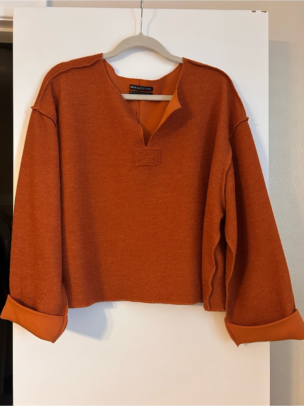 Urban Outfitters women’s oversized Rust Orange V‑Neck Split Sweater